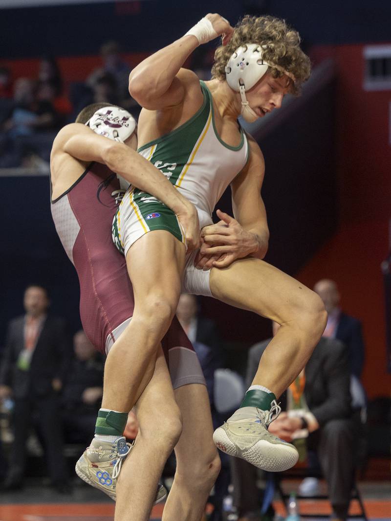 Coal City’s Cody Widlowski is thrown by Taylor Finley of Unity Christian in the 138 pound weight class of the 1A state individual wrestling finals Saturday, Feb. 22, 2025, at State Farm Center in Champaign.