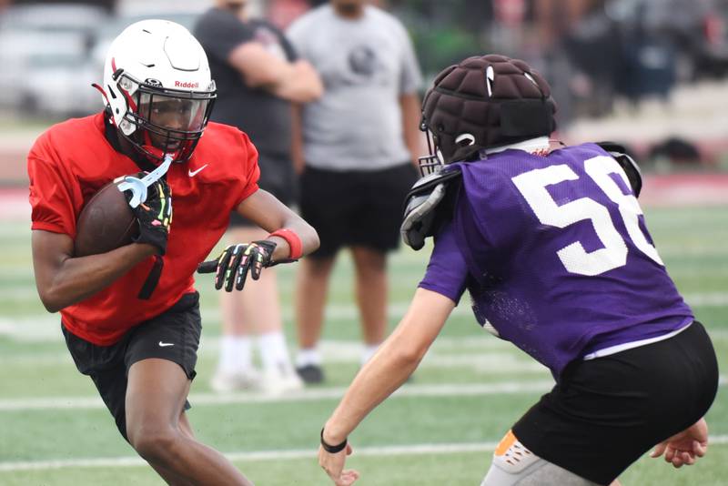 Bradley-Bourbonnais' Keyshawn Tucker, left, runs after the catch as Wilmington's Collin Van Duyne approaches during a joint summer workout at Bradley-Bourbonnais Wednesday, July 16, 2025.