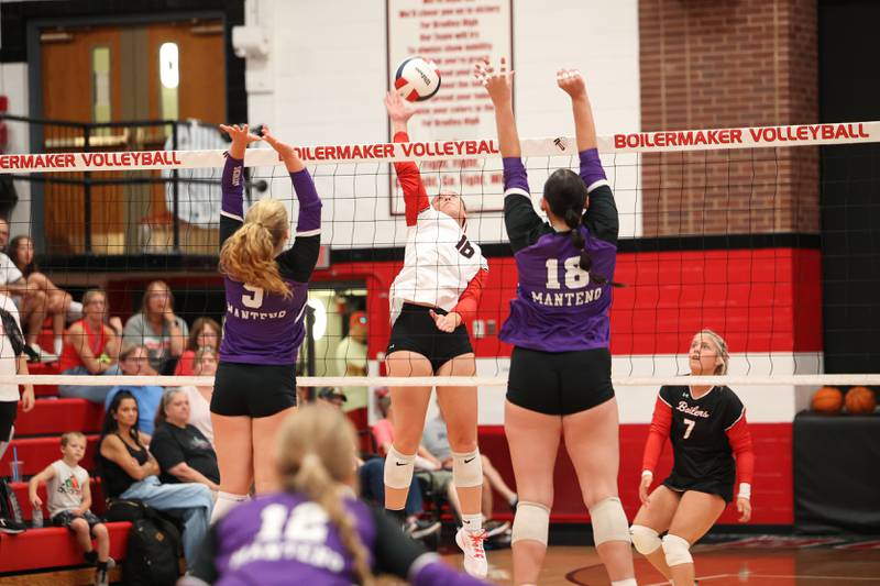 Bradley-Bourbonnais' Olivia Woolman hits under pressure from Manteno's Maddie Gesky, right, and Kendall Blanchette during the Panthers' victory in three sets, 25-21, 23-25, 25-17, over the Boilermakers on Monday, Sept. 15, 2025.