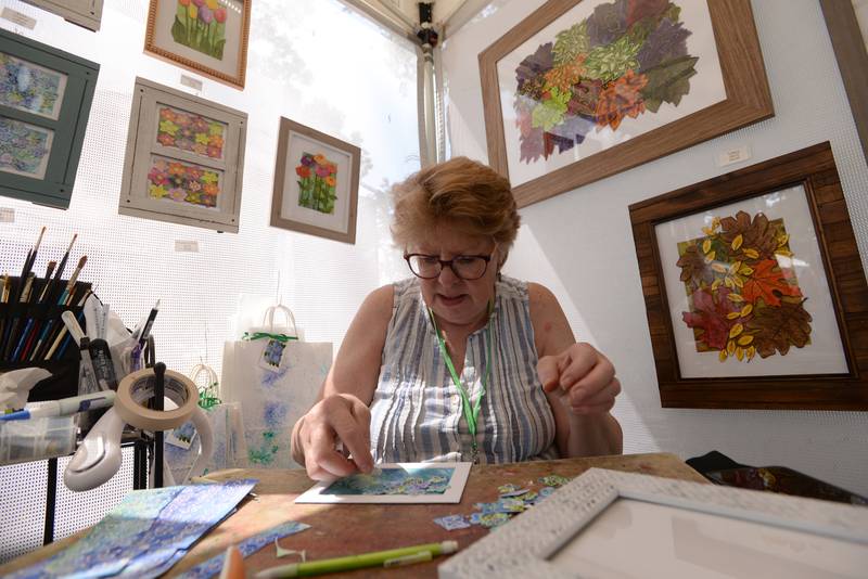 Artists including Elizabeth Waddington of McHenry work on their art during the Glen Ellyn Art Festival on Sunday, Aug 24, 2024 at Lake Ellyn.