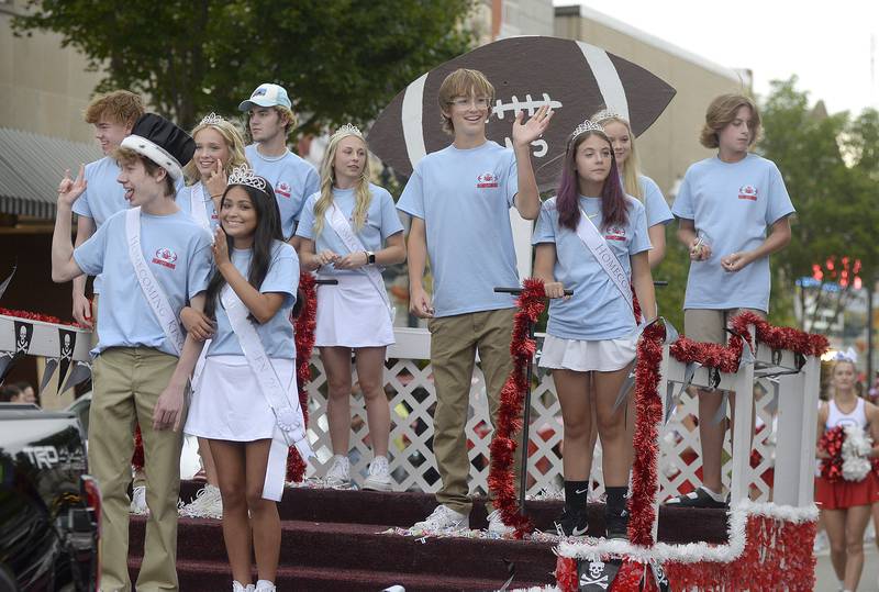The Ottawa High School Homecoming Court of 2022 waves to the crowd Wednesday, Sept. 21, 2022, along La Salle Street in Ottawa during the school’s homecoming parade.