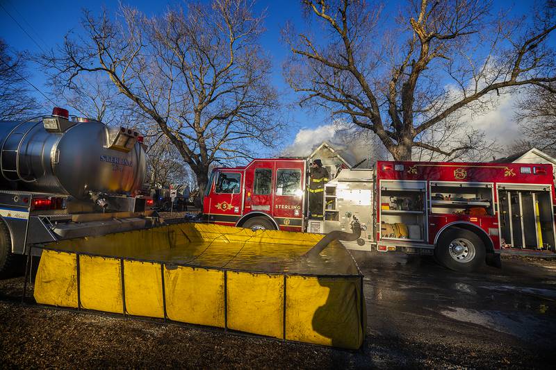 Firefighters from the area battle a fire Sunday, Jan. 19, 2025, at 550 Mill Street in Emerson.