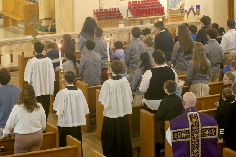 Father Tom Otto serves Mass during Ash Wednesday on Wednesday, March 5, 2025 at the Queen of the Holy Rosary Church in La Salle.