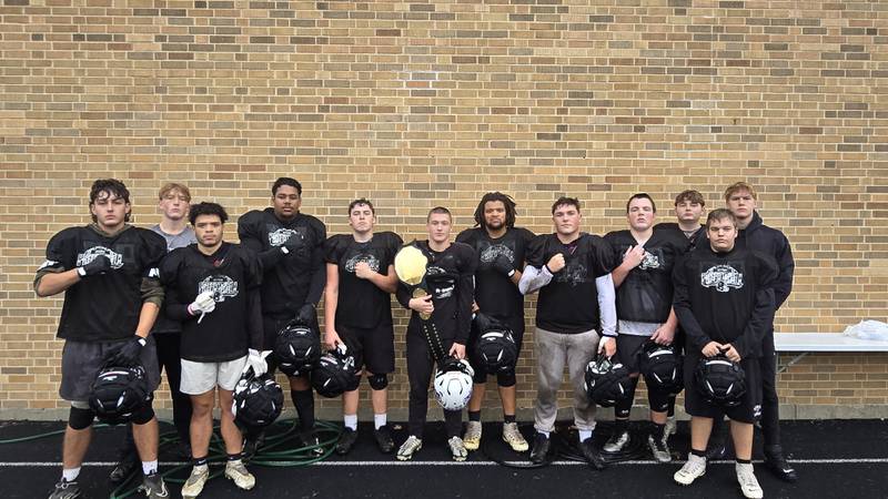 Dixon senior running back Landon Knigge, center, is pictured with his offensive linemen and the Friday Night Drive Team of the Week MVP belt after winning the award. 

Pictured, left to right, are Evan Schier, Liam Withrow, Dre Diaz, Isaiah Chattic, Chase Simpson, Landon Knigge, Dylan Bopes, Owen LeSage, Reid Whitcombe, Jordan Moore, Brayden Smice and Blake Dingley.