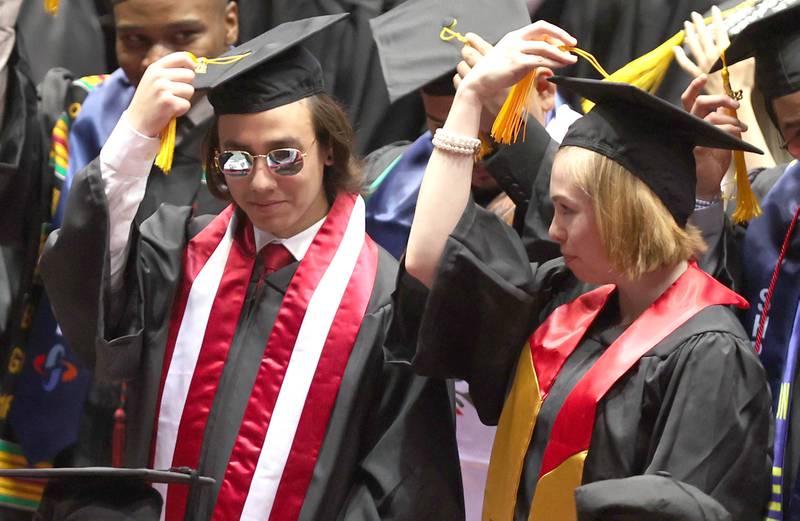 Graduates are asked to move their tassels to the other side of their hats signifying they have graduated Saturday, May 14, 2022, during the first of two undergraduate commencement ceremonies in the Convocation Center at Northern Illinois University in DeKalb.