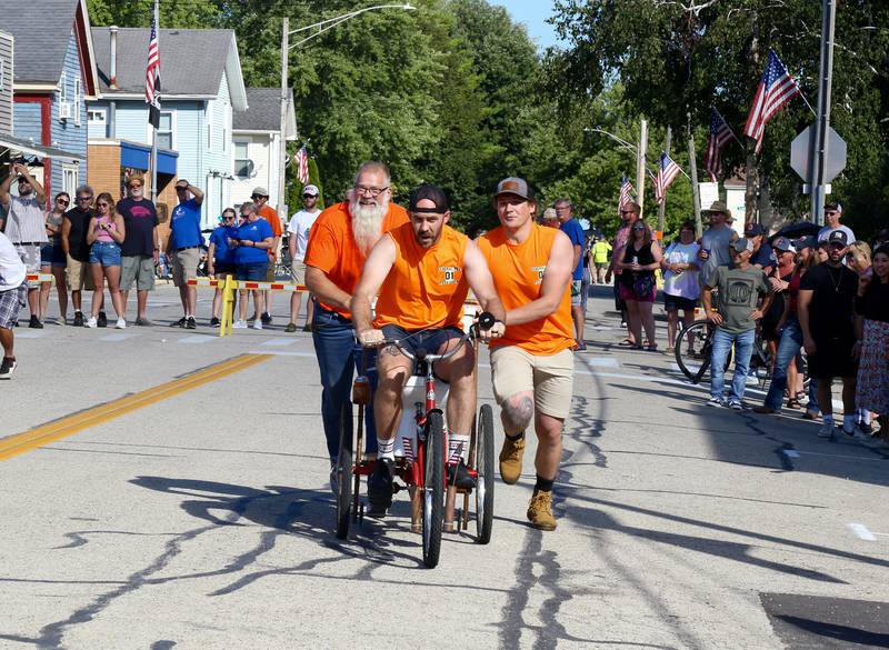 Team Orange Pee participates in the 2024 Maple Park Fun Fest Toilet Bowl Races on Saturday, Aug. 31, 2024 in Maple Park.
