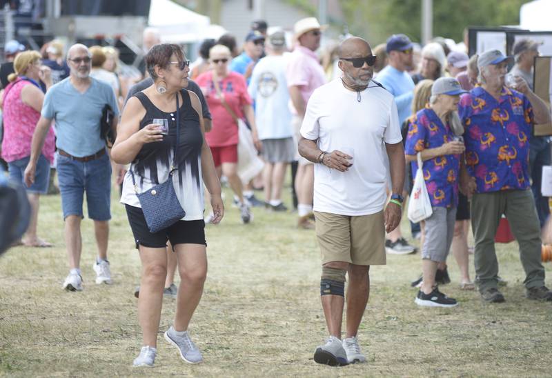 Despite the heat, large crowds enjoyed the many wine vendors during the Vintage Wine Festival Saturday at Carey Memorial Park in Utica.
