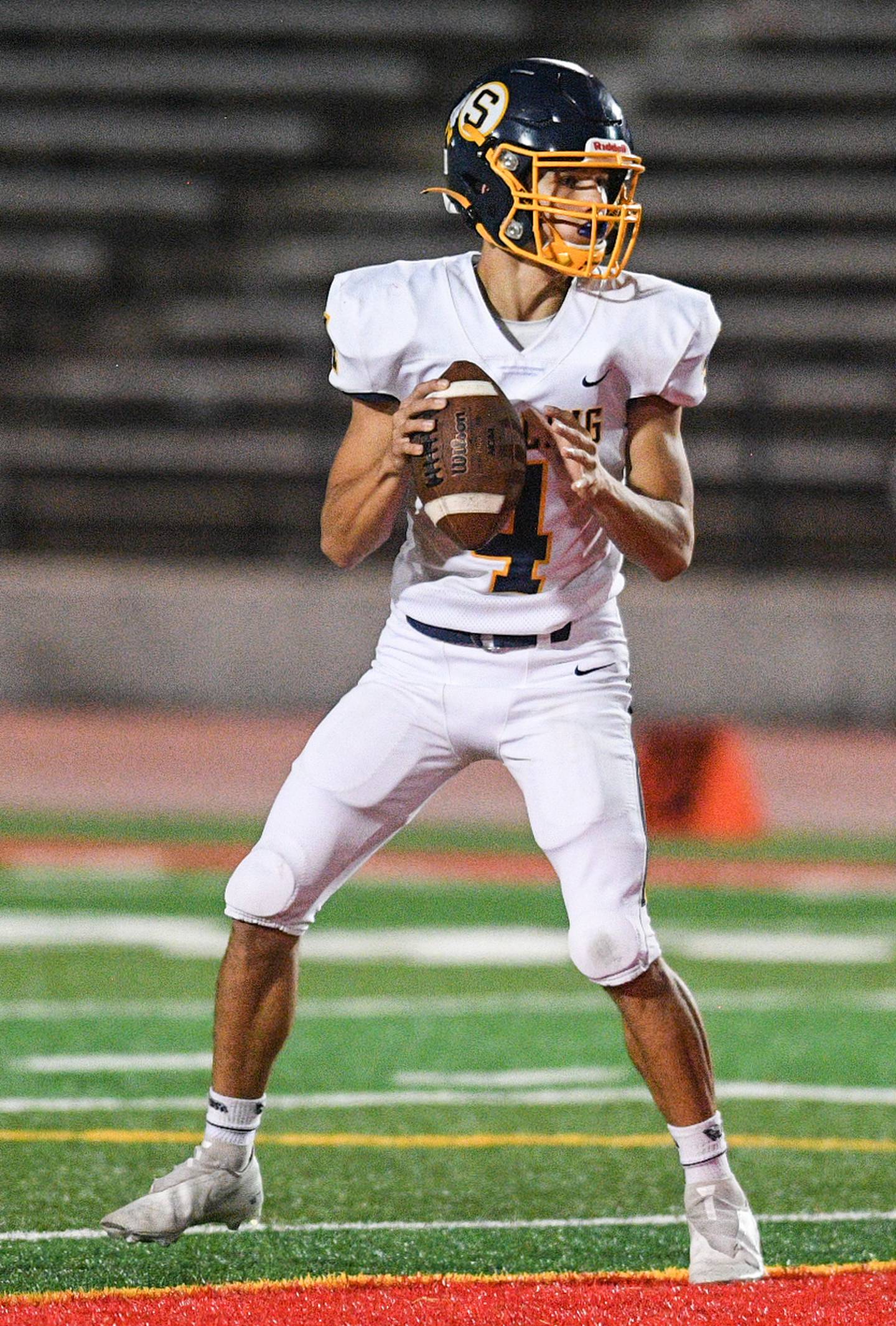 Sterling's Drew Kested (4) looks to pass against Rock Island during their game at Almquist Field Friday, Oct. 8, 2021, in Rock Island.