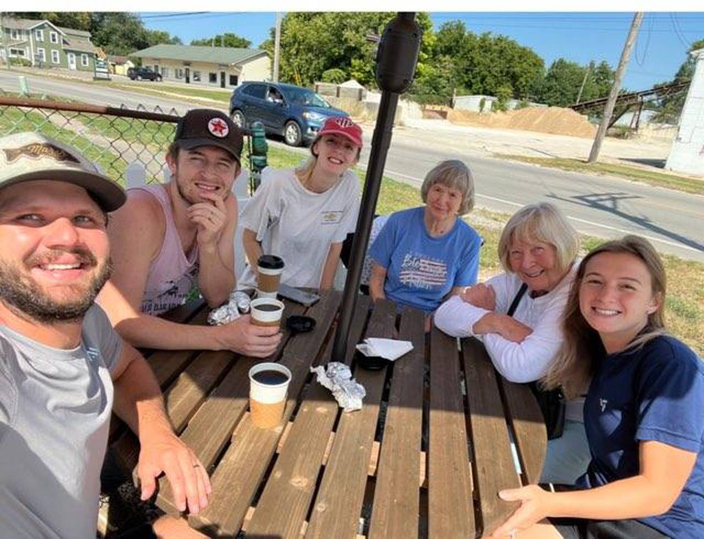 Customers sit at a picnic table in front of The Hinckley Coffee House at 320 W. Church St. in Sandwich.
