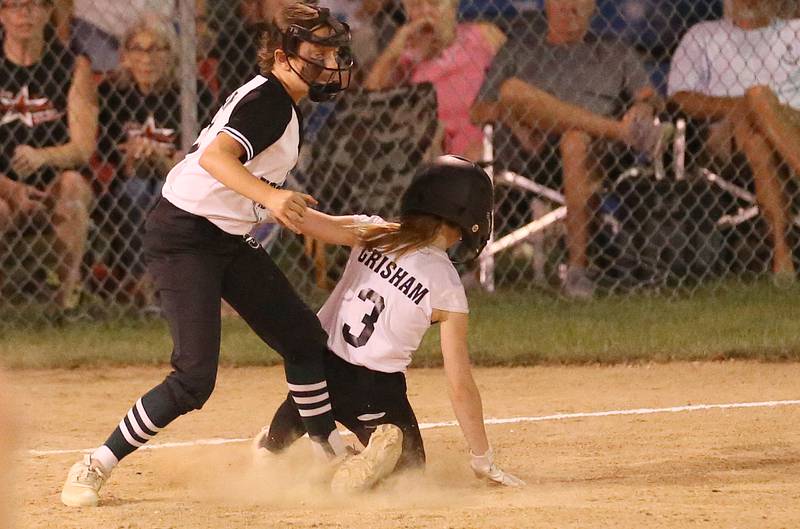 Evergreen Park's Teagan Harrigan tags out Spring Valley's Bella Grisham while trying to steal third in the Minor League Softball State title game on Thursday, July 27, 2023 at St. Mary's Park in La Salle.