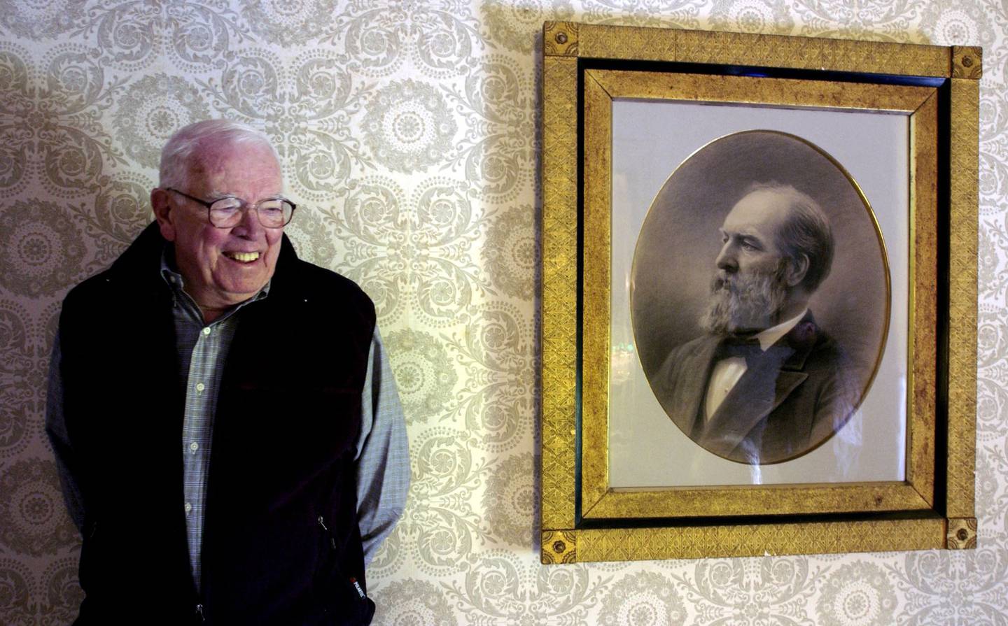 James R. Garfield, the great-grandson of President James Abram Garfield, stands next to a portrait of the late president in the upstairs hallway of the Lawnfield Home in Mentor, Ohio, on Oct. 3, 2003.  The former president, assassinated in 1881, was the head of the future Hiram College, a Civil War major general, a 17-year congressman and the first lawyer to make his courtroom debut before the U.S. Supreme Court.