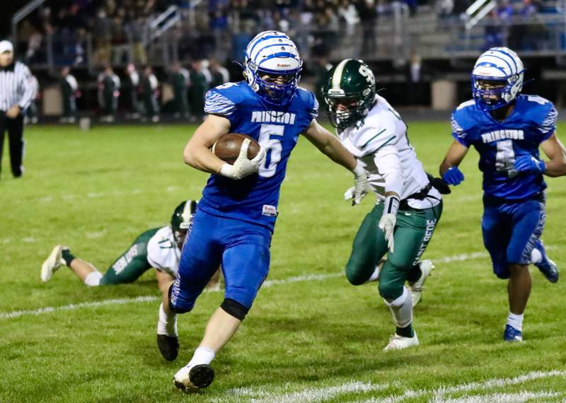 CJ Hickey runs for Princeton Friday Night against St. Bede at Bryant Field. The Tigers won 56-7.