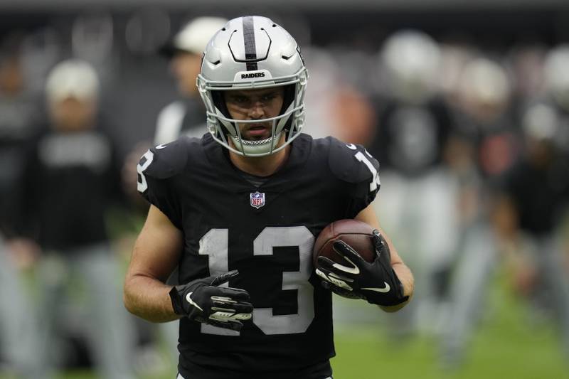 Las Vegas Raiders wide receiver Hunter Renfrow (13) warms up before an NFL football game against the Arizona Cardinals, Sunday, Sept. 18, 2022, in Las Vegas. (AP Photo/John Locher)
