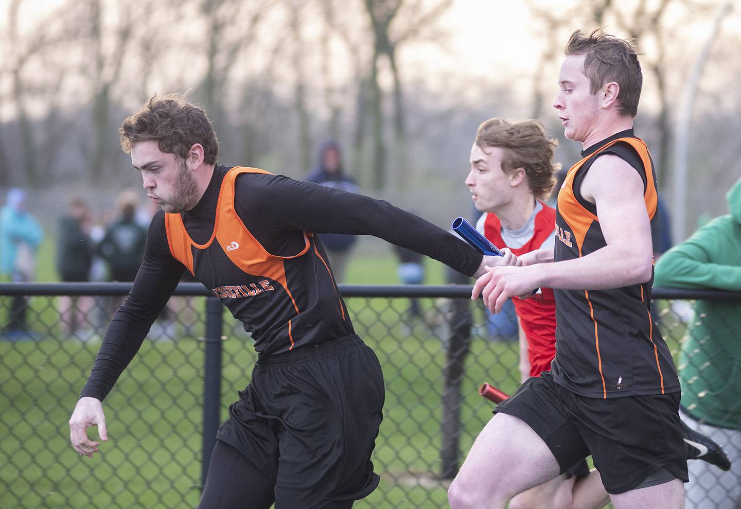 Milledgeville's Gage Wilk takes the baton from brother Kolton in the 4x100 Friday, April 22, 2022 at the Rock Falls track invitational.