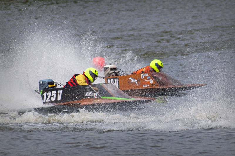 Billiam Pavlick (left) and Lauren Hagelstein battle for the lead in one of several races held Saturday, August 6, 2022 during the Rock Falls River Chase.