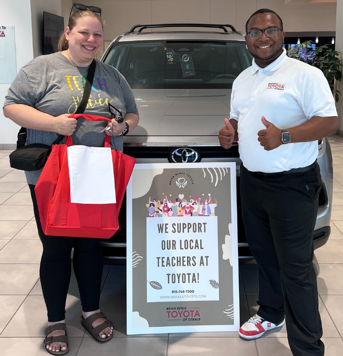 DeKalb school teacher receiving Brian Bemis Toyota of DeKalb school supplies donation