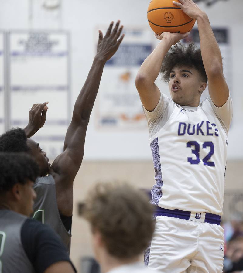 Dixon’s Darius Harrington puts up a shot against Plainfield Central Friday, Jan. 3, 2025, at Dixon High School.
