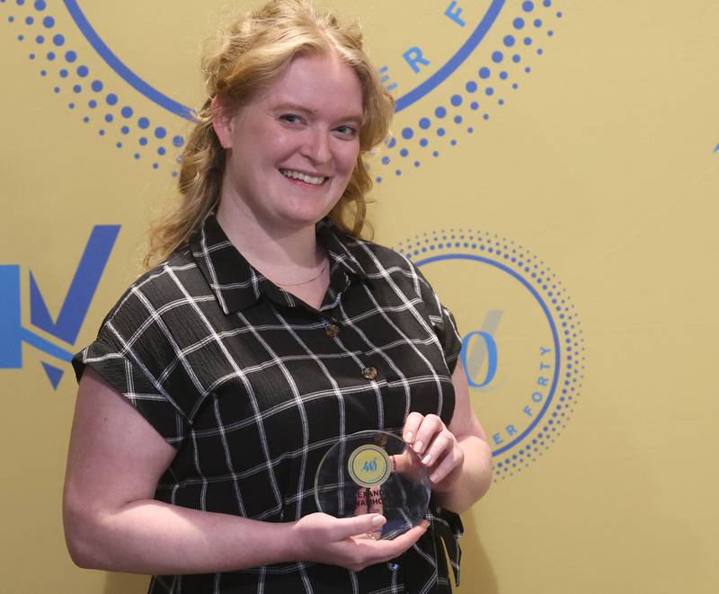 Alexandria Wamhoff poses with her 40 Under Forty award during the Illinois Valley Chamber of Commerce Champions of Change Awards Night on Wednesday, May 6, 2026 at the Westclox Event Center in Peru.