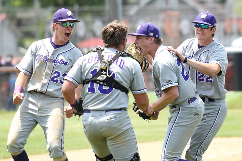 From left, Wilmington's Cooper Holman, Zach Ohlund, Lucas Rink and Ryan Kettman greet one another in celebration following the Wildcats' 5-4 win over Bishop McNamara in the IHSA Class 2A Beecher Sectional championship Saturday, May 31, 2025.
