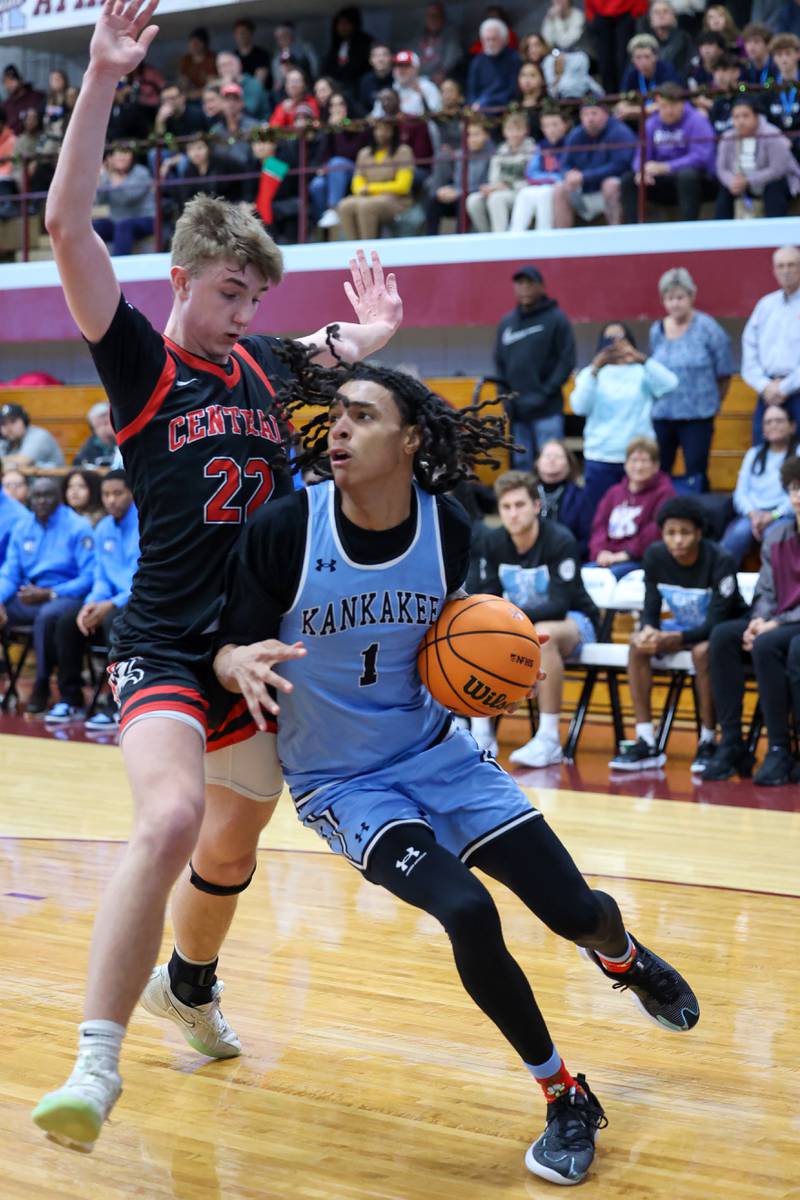 Lincoln-Way Central's Nick Brzezniak defends a drive by Kankakee's Lincoln Williams during the Kays' 54-50 victory over Lincoln-Way Central in the 75th Kankakee Holiday Tournament maroon bracket championship on Sunday, Dec. 28, 2025.