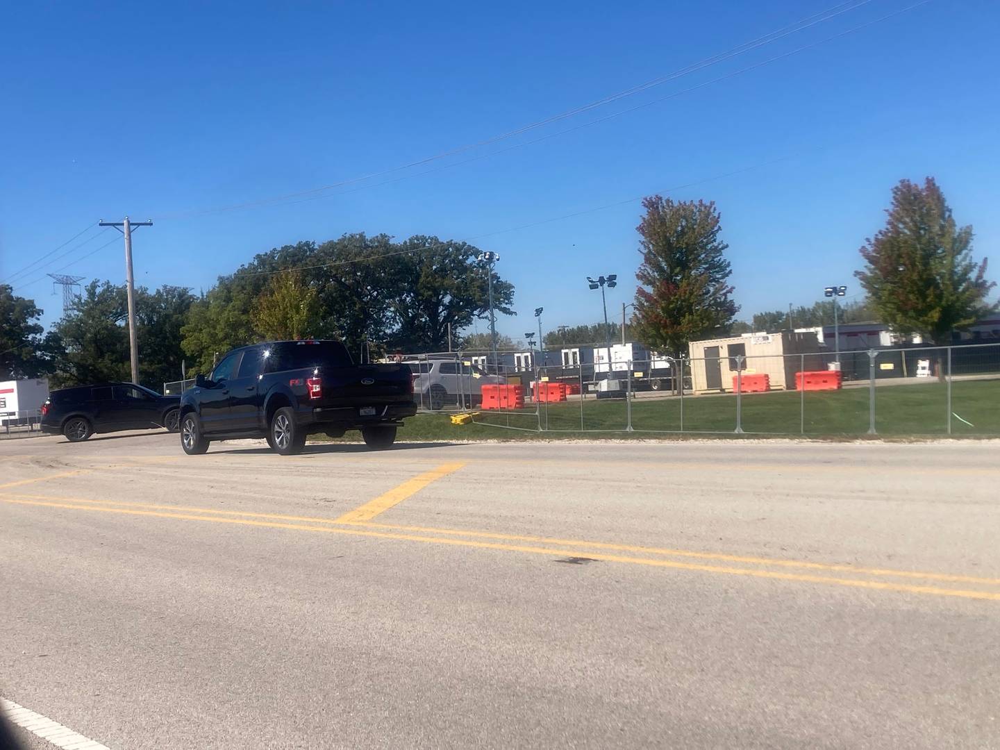 Three vehicles line up to enter the Army Reserve Training Center in Elwood on Thursday, Oct. 9, 2025.