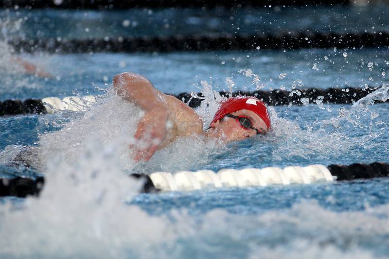 Hinsdale Central’s Andrew Gilbert swims in the championship heat of the 400-yard freestyle relay during the IHSA Boys Swimming and Diving Championships at FMC Natatorium in Westmont on Saturday, Feb. 26. 2022.
