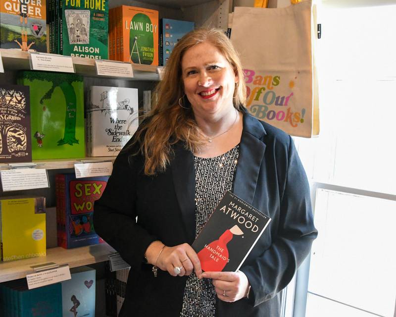 Jen Hall poses for a photo on Friday Oct. 3, 2025, at the Harvey’s Tales bookstore in Geneva.