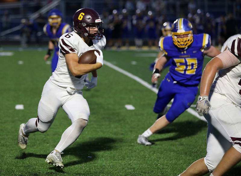 Richmond-Burton's Hunter Carley runs around the end during a Kishwaukee River Conference football game against Johnsburg on Friday, Sept. 12, 2025, at Johnsburg High School.