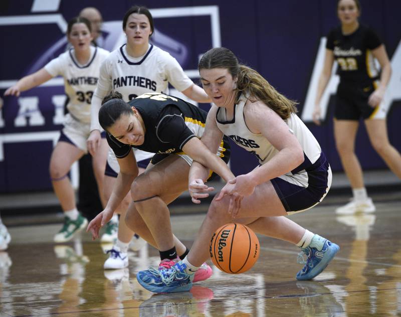 Manteno's Emily Horath, right, and Herscher's Leia Haubner, left, scramble for a loose ball in a game in Manteno on Thursday, January 15, 2026.