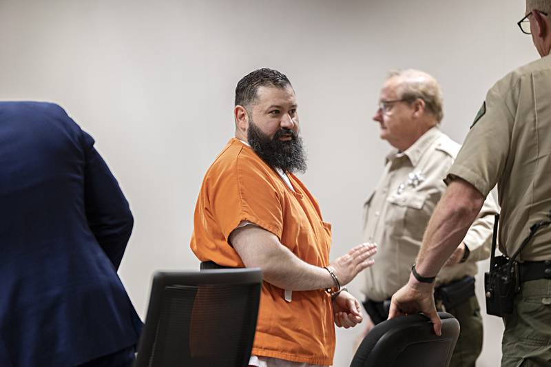 Michael Bennett waves to supporters Thursday, Oct. 19, 2023 in Whiteside County court. Bennett was convicted of two counts of first degree murder and sentenced to 60 years in prison.