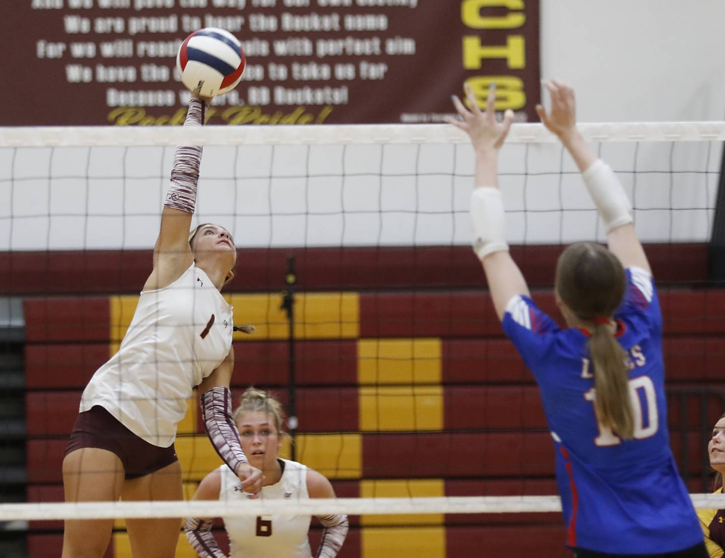Richmond-Burton's Sophia Komar tries to hit the ball through the block of Lakes’ Isabel Stauber during a nonconference volleyball match on Monday, Sept. 29, 2025, at the Richmond-Burton High School in Richmond.