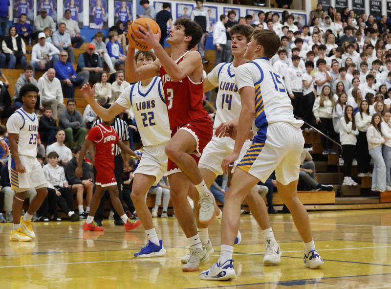 Hinsdale Central's Cole Bero (3) puts up a shot during a varsity basketball game between Hinsdale Central and Lyons Township high schools on Friday, Dec. 12, 2025 in La Grange.