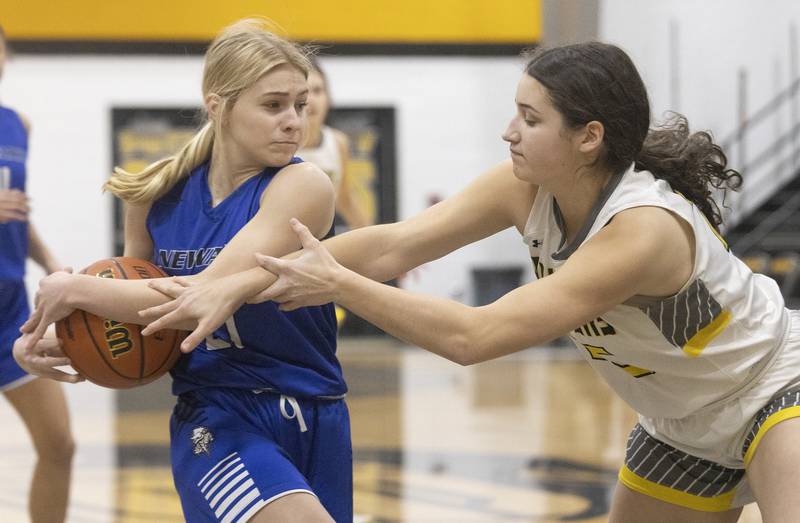 Newark's Addison Ness tries to get by Putnam County's Maggie Richetta during the Class 1A Regional final game on Thursday, Feb. 16, 2023 at Putnam County High School.