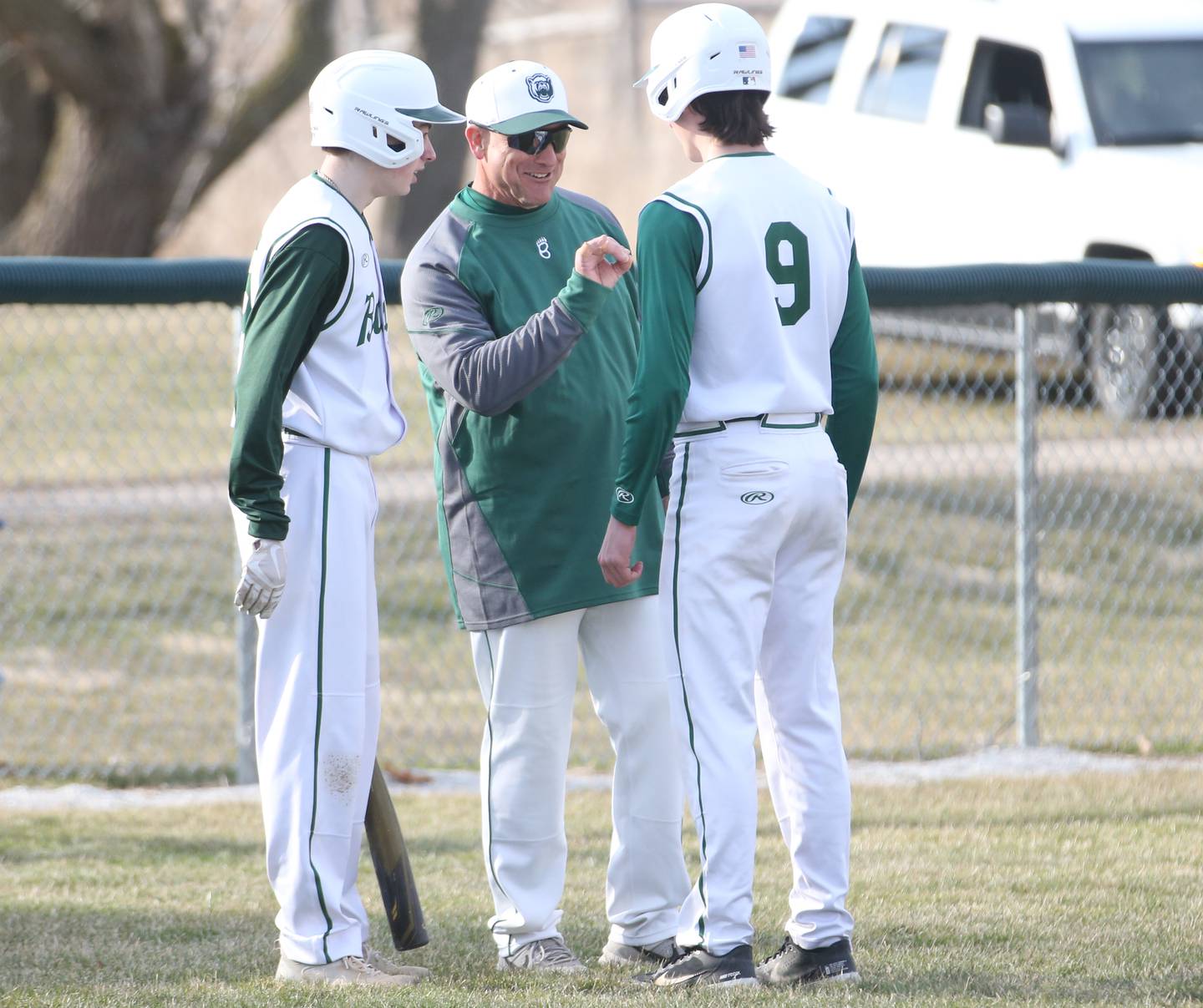 St. Bede head boys baseball coach Bill Booker (center) coaches players Alex Ankiewicz and Ryan Slingsby against Riverdale on Monday, March 20, 2023 at St. Bede Academy.