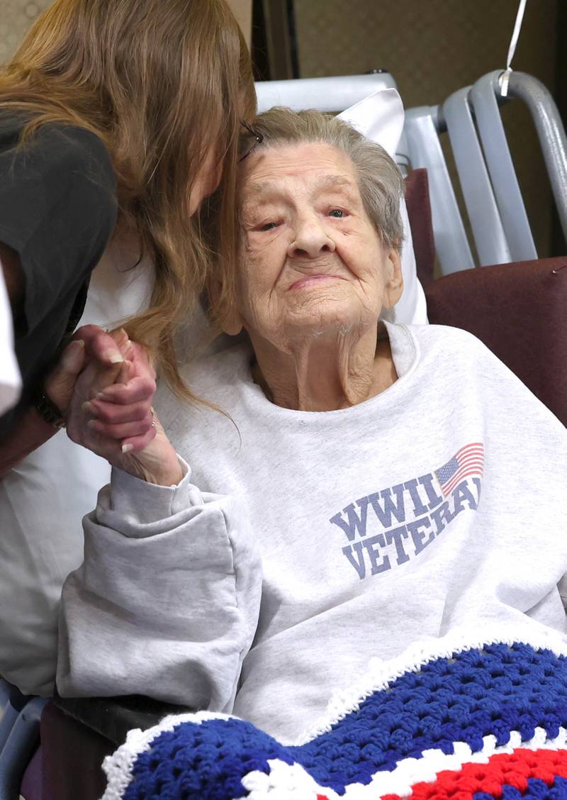 World War II veteran Myrtle Annetta Lusiak greets well-wishers Thursday, May 2, 2024, during her birthday celebration at Aperion Care in DeKalb. Lusiak, who turned 107-years-old, was honored by DeKalb officials, veterans and other local groups Thursday for her service in the Women’s Army Corps from Aug. 5, 1943 until her honorable discharge on Nov. 27, 1945.