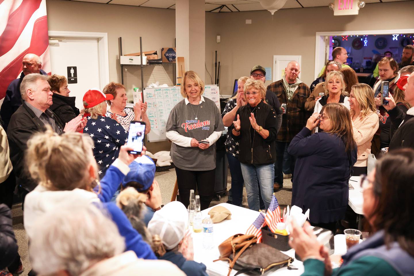 Surrounded by fellow Manteno Freedom Party candidates and supporters, Manteno mayor-elect Annette LaMore gives a victory speech on Tuesday night during at a watch party at the Manteno American Legion.