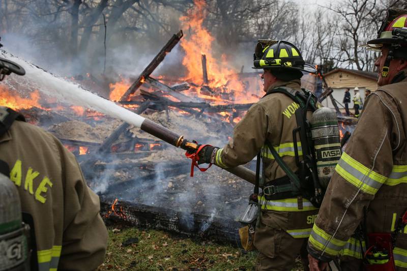 Harvard firefighters put out a fire that Wednesday, Nov. 24, 2021, burned an empty barn.