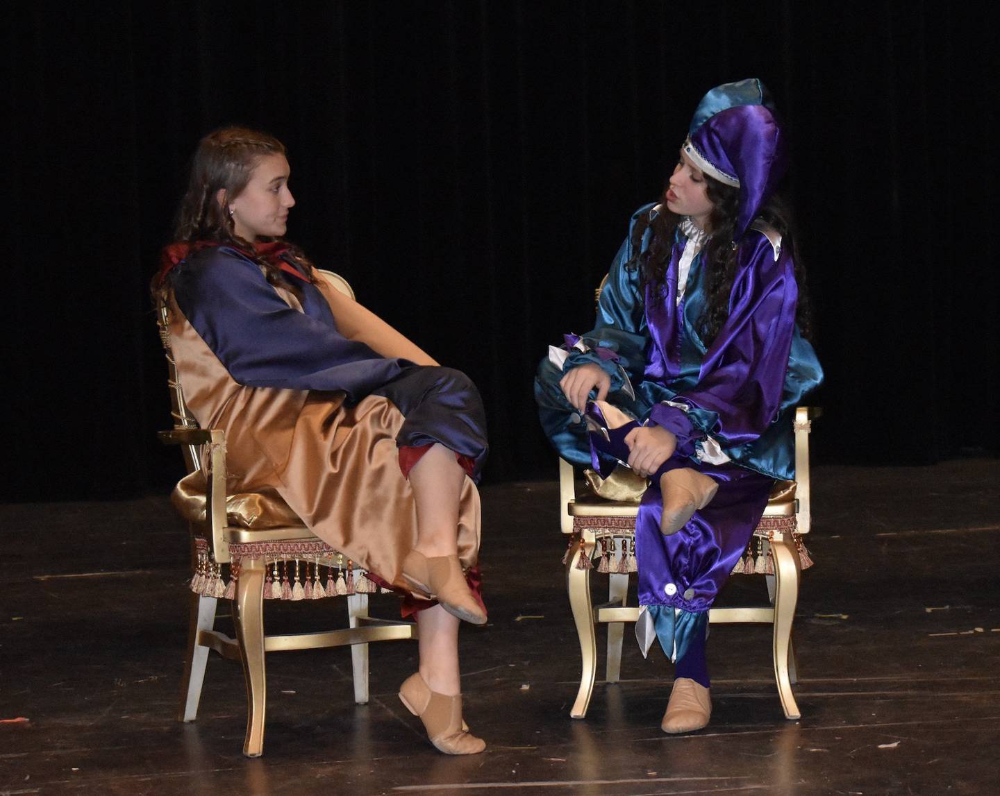 Coal City High School students Izzy Kostbade [left] and Adeline Dowling [right] serve as jesters of the Madrigal royal court. The Madrigals will host their annual holiday performances in the Coal City Performing Arts Center, Dec. 9-11.