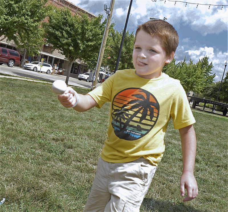 Ace Coughlin keeps his eyes glued to the finish line as he competes Saturday, Aug. 6, 2022, in the egg spoon race as part of Kid’s Play Day at the Jordan block in Ottawa.