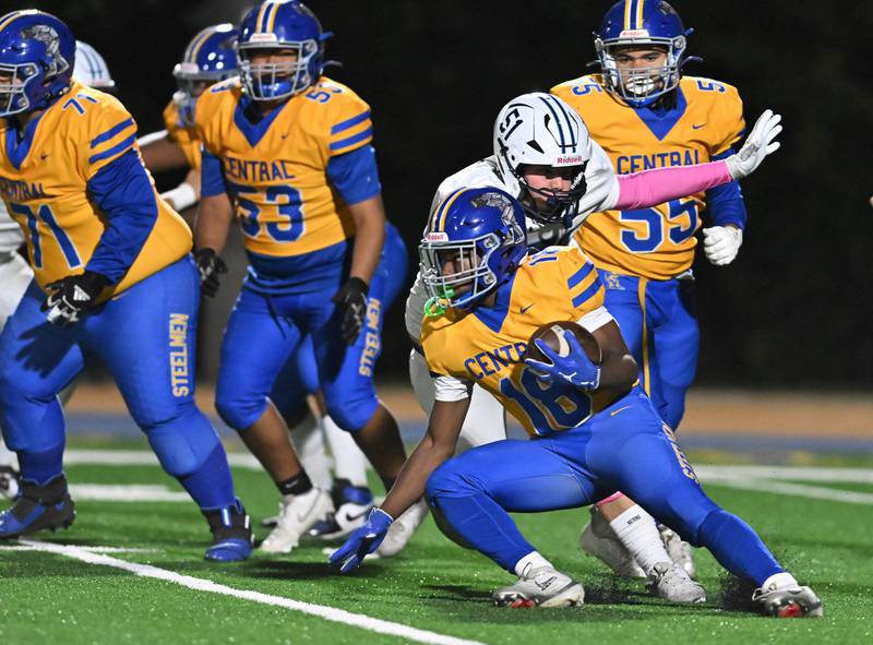 Joliet Central's Tristen Sellers (18) runs the ball during the conference game against Plainfield South on Friday, OCT. 17, 2025, at Joliet.