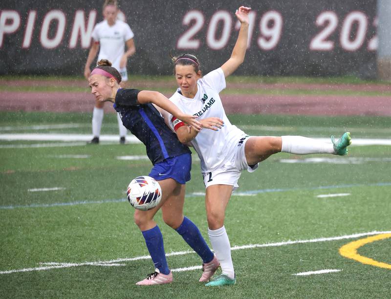 Burlington Central's Kendall Grigg and Peoria Notre Dame's Elly Bare get tangled up going after a ball during their third place game Saturday, June 1, 2024, at the IHSA Class 2A state soccer finals at North Central College in Naperville.