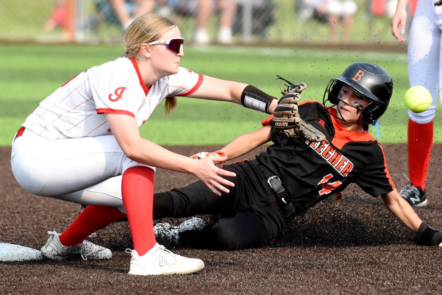 Brimfield's Kendyl Binder, left, fields a throw at second base as Beecher's Liliana Irwin slides in for a stolen base during the Class 2A East Peoria Super-Sectional Monday, June 2, 2025.