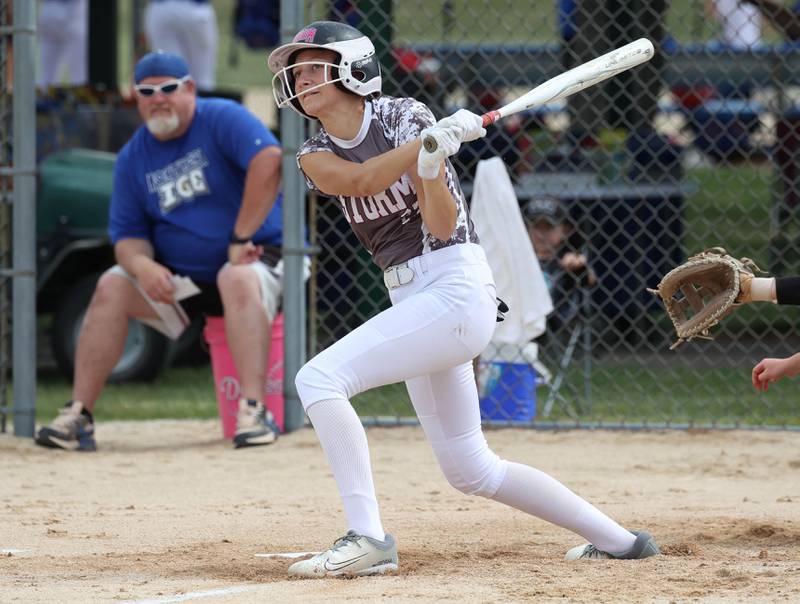 Kishwaukee Valley Storm's Gretta Oziah drives the ball into left field Friday, June 27, 2025, during their 16u game against Northern Ice in the Storm Days tournament at the Sycamore Community Sports Complex.
