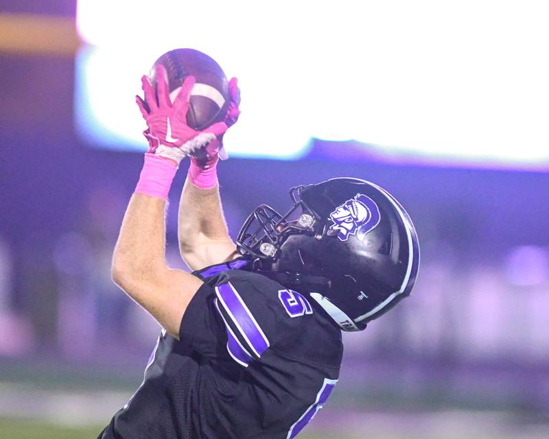 Downers Grove North's Max Troha (5) catches a pass during the game on Friday Oct. 10, 2025, while taking on York High School held at Downers Grove North High School.
