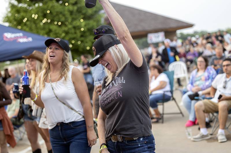 Heather Hulstrom of Sterling cheers along to Kelsey Hart Saturday, May 31, 2025, at the River Country Summer Kickoff 2025 in Dixon.