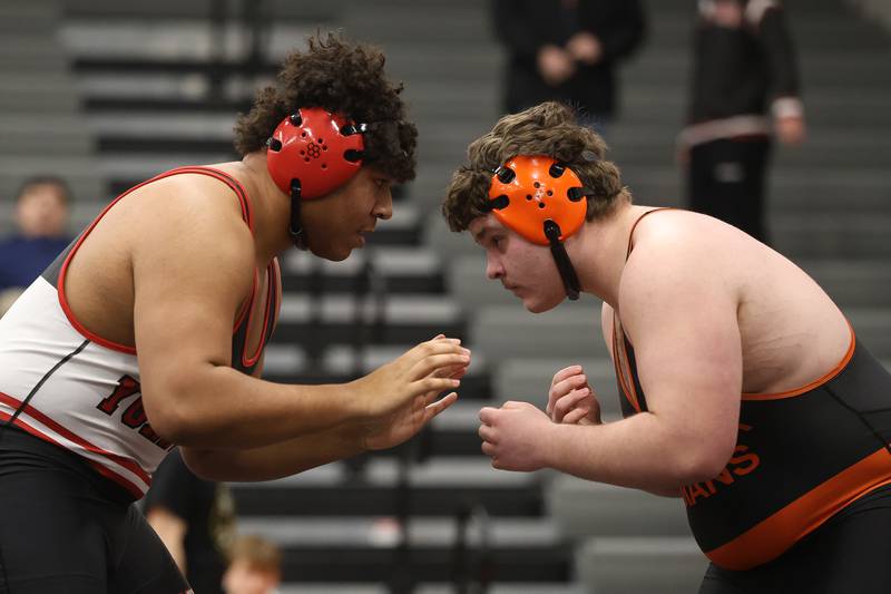 Yorkville’s Xavion Uiloa, left, faces off with Minooka’s Robbie Murphy in the SouthWest Prairie Conference 285 pound championship on Saturday, Jan. 24, 2026 in Minooka.