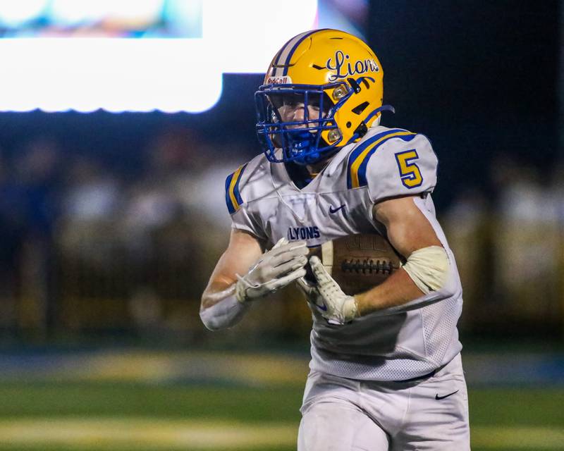 Lyon's Danny Caroll (5) runs near the sidelines during football game between Hinsdale Central at Lyons.  Sept 8, 2023.