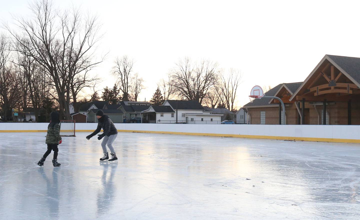 An aerial view of skaters skating on the ice on Thursday, Dec. 5, 2024 at Washington Park in Peru.
