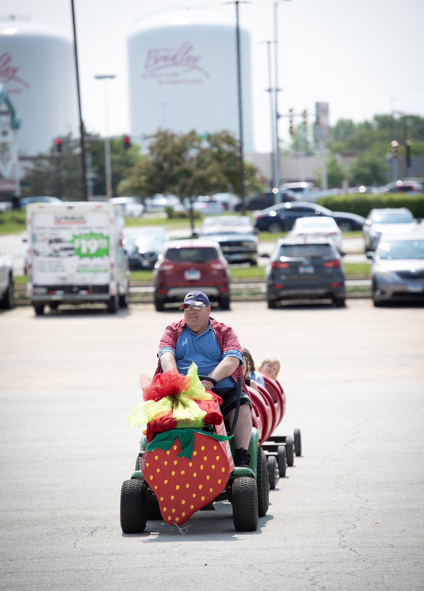 Michael Cote, of Aroma Park, ferries children on a tractor ride at Strawberry Jazz Fest at Northfield Square Mall in Bradley on Sunday, June 1, 2025.