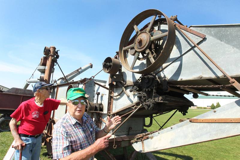 Don Snetsinger, of McHenry, founder, and Larry Stahl, of Grayslake talk about how farmers use a thrasher during the Lake County Farm Heritage & Harvest Festival at the Lake County Fairgrounds on September 23rd in Grayslake. The festival was sponsored by the Lake County Farm Heritage Association.
Photo by Candace H. Johnson for Shaw Local News Network